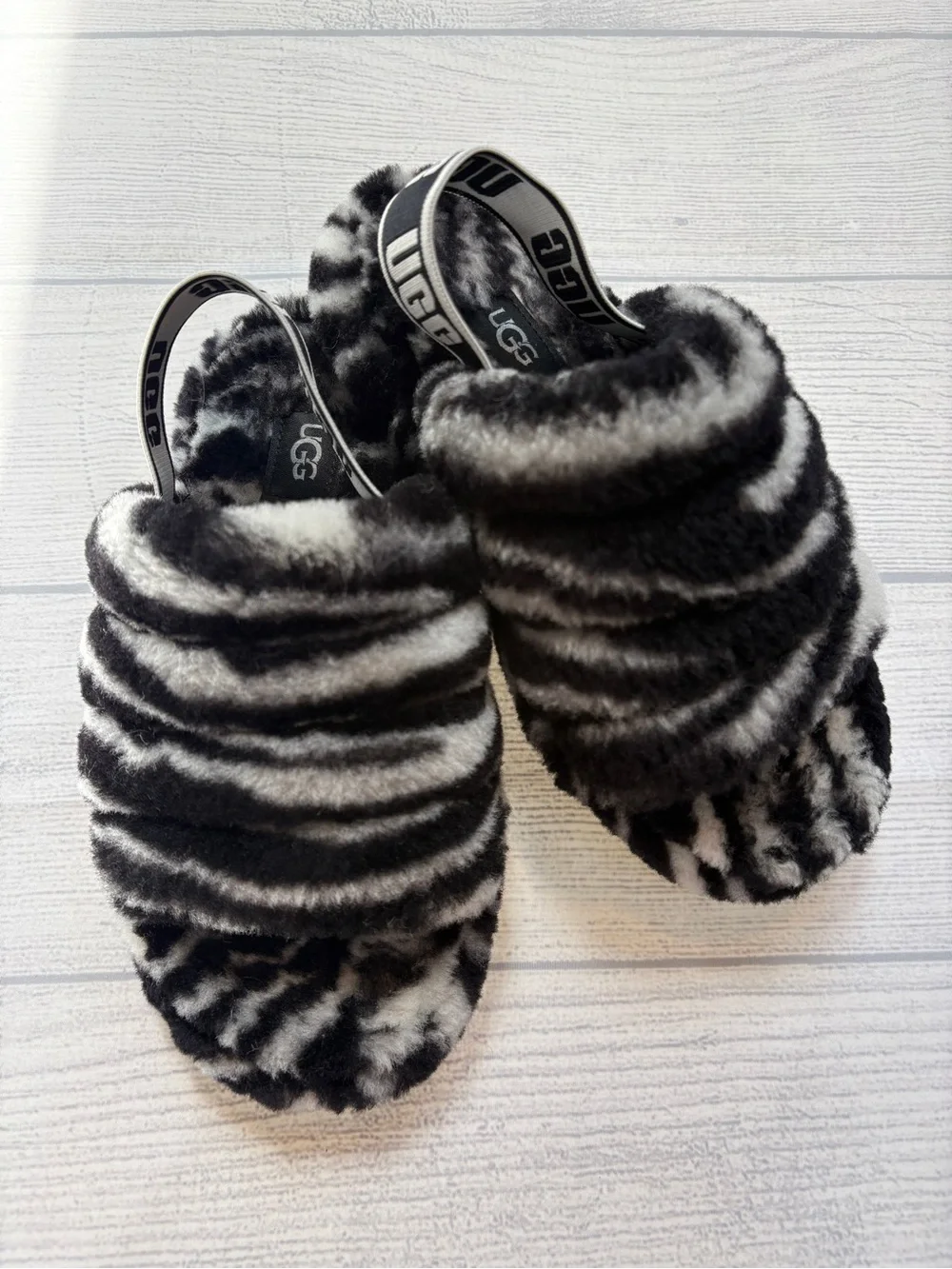 UGG kids Black & White Faux Fur Slide Slippers with Branded Heel Strap